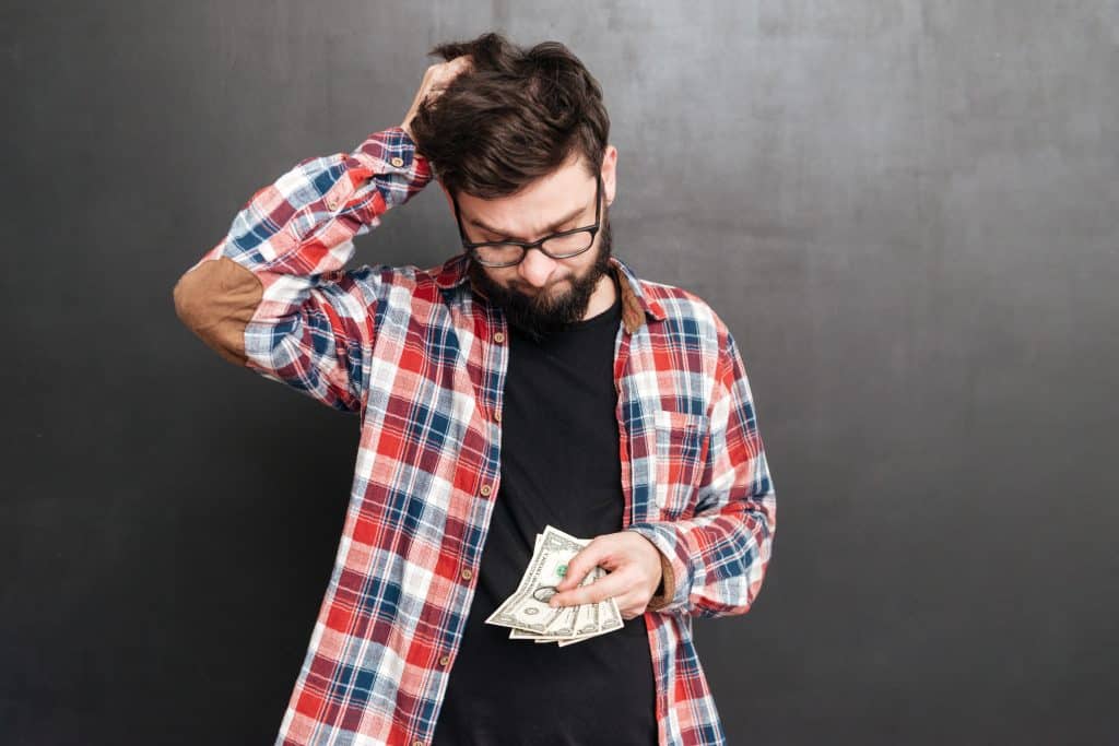 graphicstock photo of confused man dressed in shirt in a cage and wearing glasses standing over chalkboard while holding money B8f7QuXO2g Huskies as Pets: Costs, Life Expectancy, and Temperament